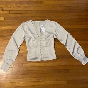 Super cute fitted champagne colored blouse